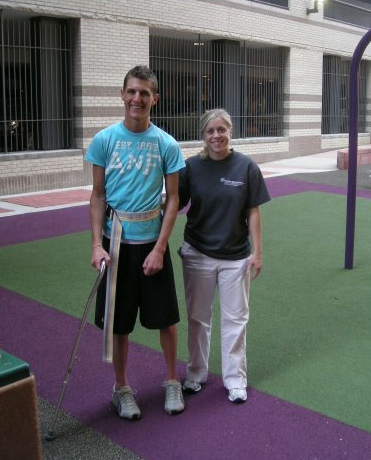Josh walking with Brittany during physical therapy