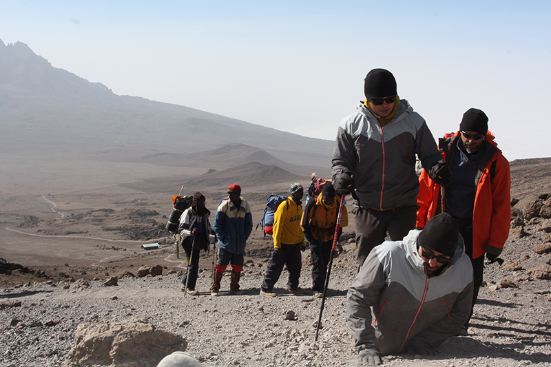 Spencer West with friends climbing Mt. Kilimanjaro