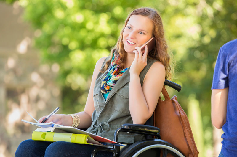 Woman in wheelchair on phone