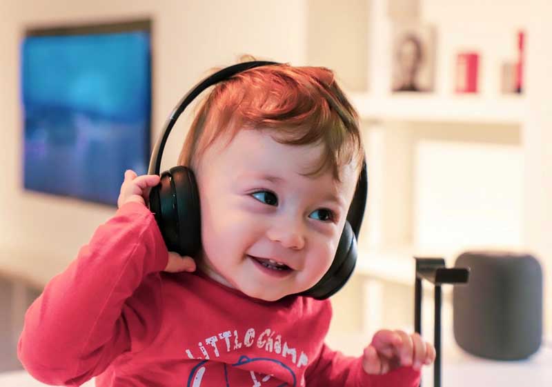 Young child wearing headphones
