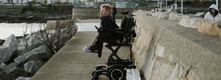 Power Wheelchair Seat Elevation Allows Kevan to See More of the World