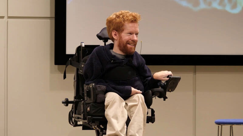 Kevan using his power wheelchair