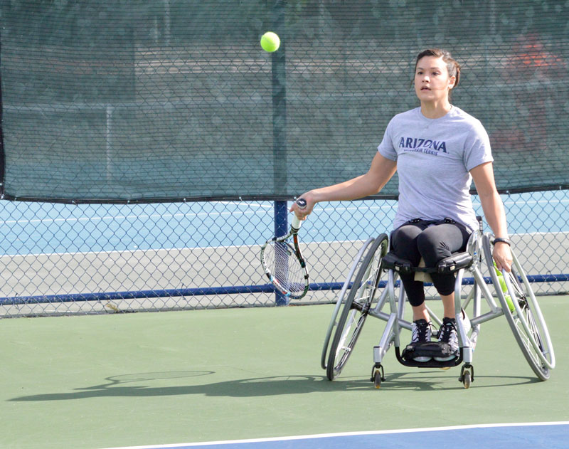 A student at the University of Arizona playing wheelchair tennis