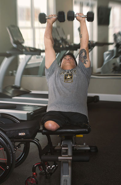 A double-amputee working out