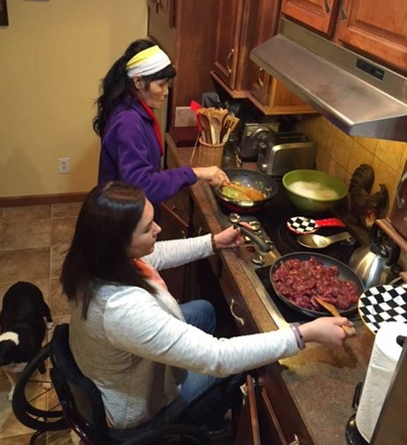 Jessica cooking with her mother in her wheelchair-accessible kitchen