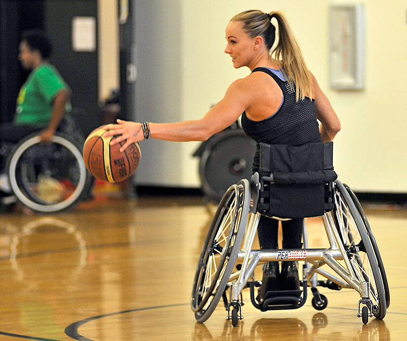 Megan Blunk playing wheelchair basketball