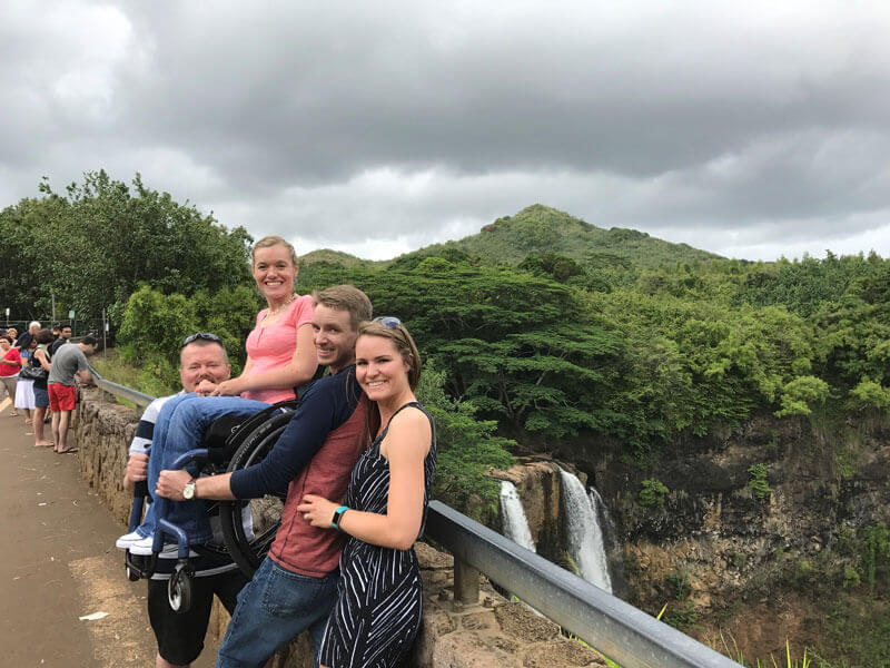 Jenny with her caregivers in Hawaii