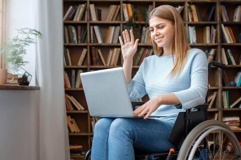 A woman using a wheelchair in a telehealth appointment