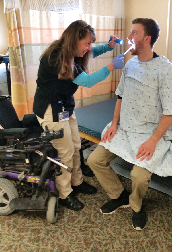 Karen examining a patient