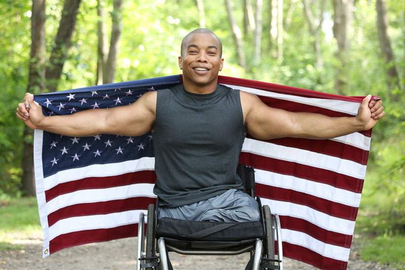 U.S. military veteran with American flag
