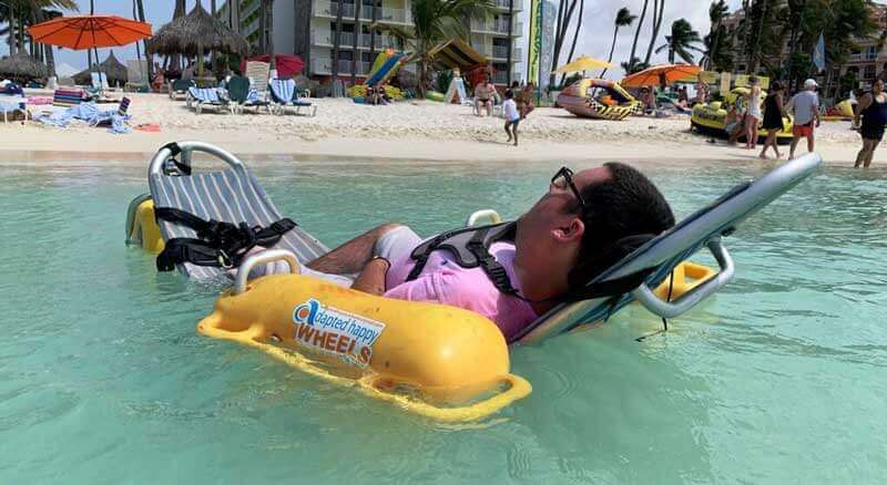Cory Lee using an aqua chair