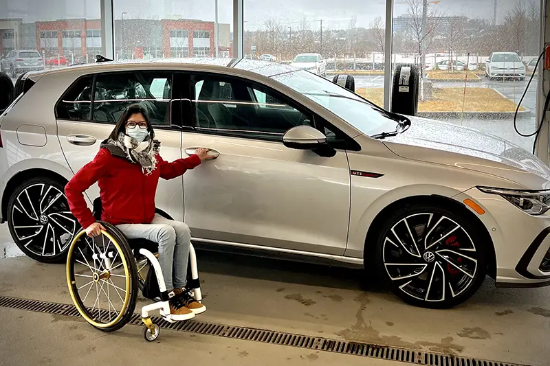 Geneviève with her newly adapted Volkswagen GTI